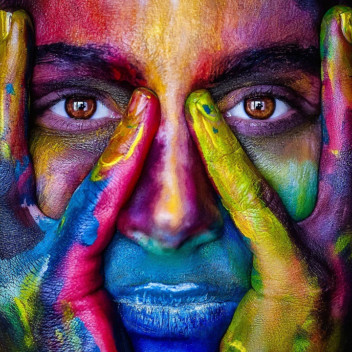 About us - picture of a colorful painted face
